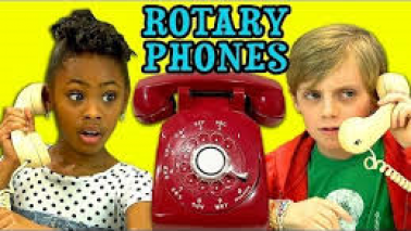 Kids try figuring out a rotary phone!