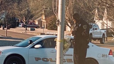 Officer seen praying for students at school's flagpole every day